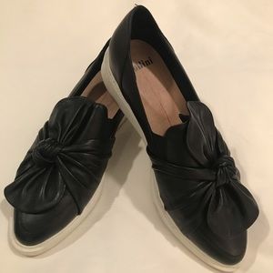 Black Mollini bow flats